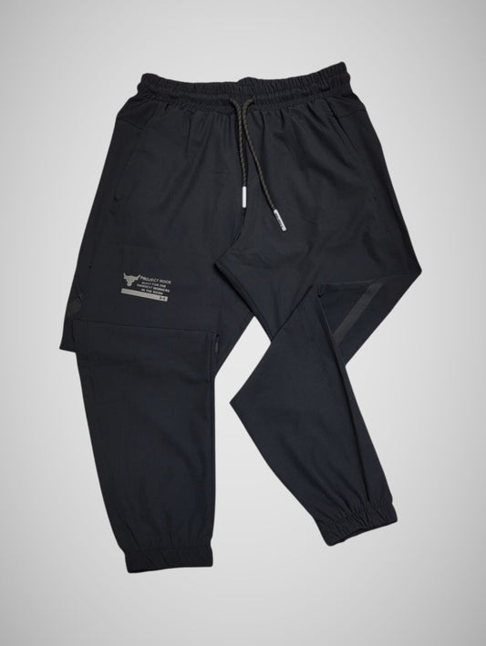 PROJECT ROCK PARACHUTE PANTS